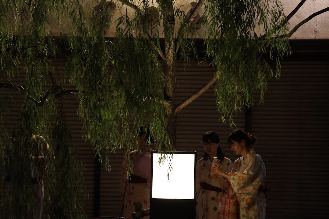Team of editors reviewing archival advertising footage on a light table